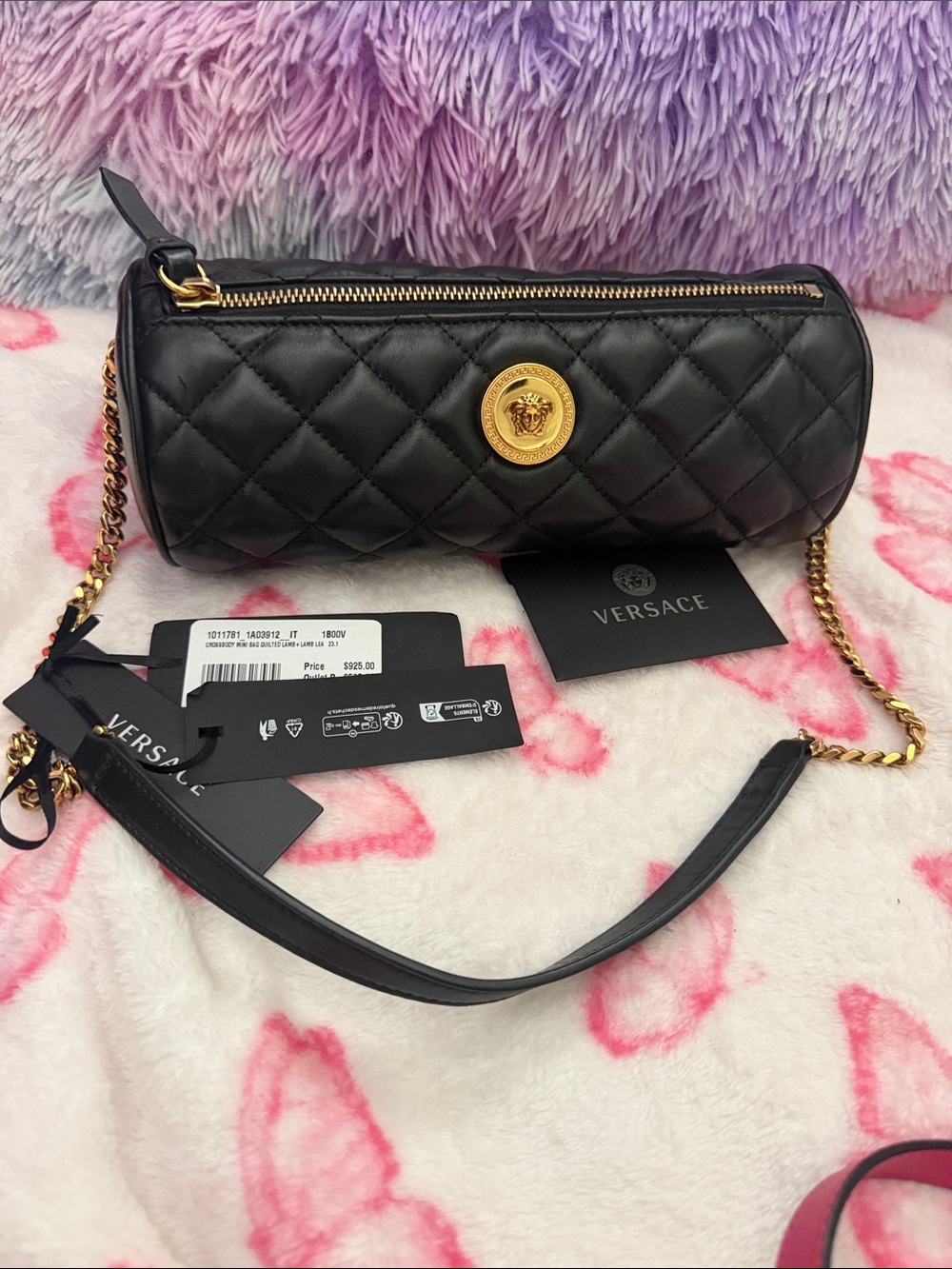 Black Quilted Cylinder Crossbody Bag with Gold Hardware